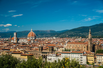 Fototapeta na wymiar Cathedral of Santa Maria del Fiore in Florence, Italy. Beautiful cityscape image with red roofs of renaissance and medieval architecture.