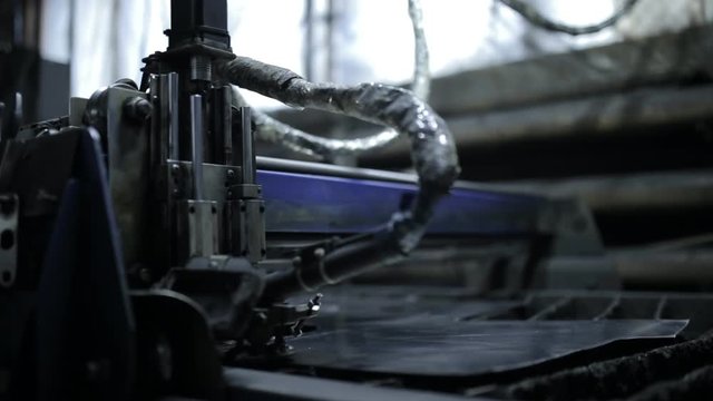 industrial machine, laser cutting through metal sheet