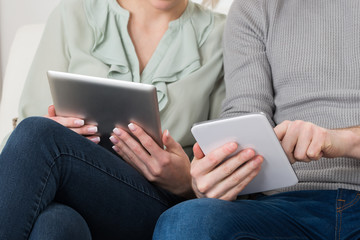 Young Couple With Digital Tablets