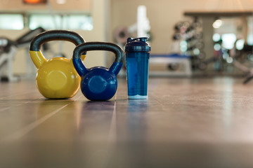 Family sport or weight loss concept. Dumbbells, towel and shaker