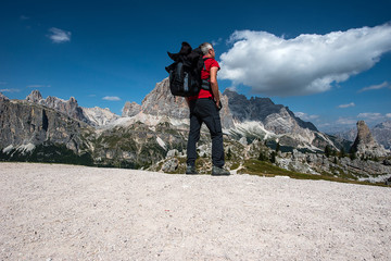 Trekker is watching at Le Tofane, Dolomites