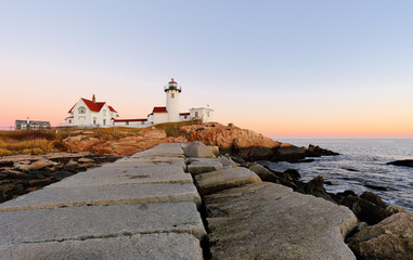 Eastern Point Lighthouse at Gloucester at Sunset, Massachusetts, USA. One of the five iconic lighthouses have been built along the Cape Ann coastline to protect seafarers from rocky shores and shoals.