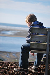 Young Boy On Bench 