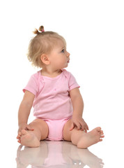 Infant child baby girl toddler sitting and looking up