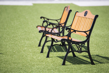 wooden chairs on the green grass