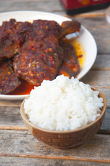 Tilapia with sweet spicy sauce eating with hot rice