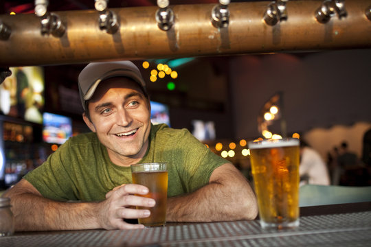 Man drinking beer in bar