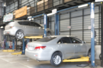 Fototapeta na wymiar Blurred abstract background of car in garage
