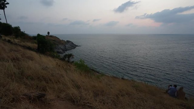 sunset on hill and the sea background with couple video timelapse hd