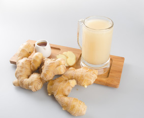 Ginger tea or fresh ginger tea on background.