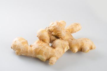 ginger or fresh ginger root on the background.