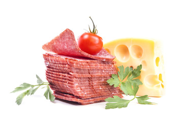 stack of sliced salami with a piece of Dutch cheese