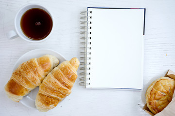 croissant cup coffee white book
