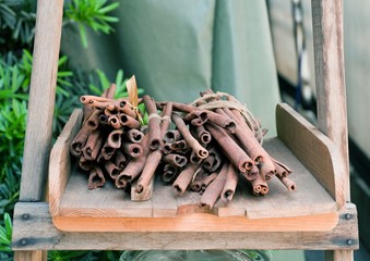 Dry Cinnamon Sticks on A Wooden Shelf