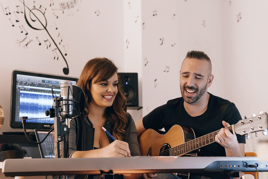 Couple of singers composing a song.