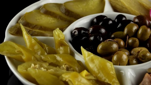 Plate of pickles (eggplant, cucumbers, turnips, olives), loop