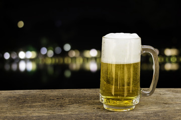 Beer in glass on background with bokeh