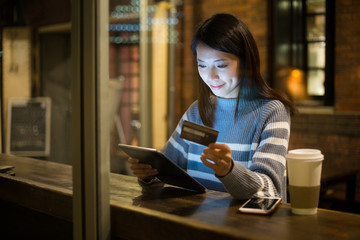 Woman pay credit card on tablet pc