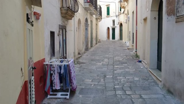 Small typical street in the old town of Gallipoli, on the Salentina Peninsula, Italy.
