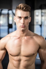 Fototapeta na wymiar Fit muscular man posing shirtless
