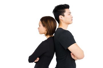Depressed couple standing back to back