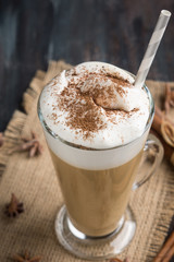 Coffee in glass on the wooden background