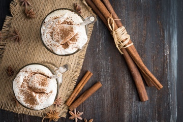 Coffee in glass on the wooden background