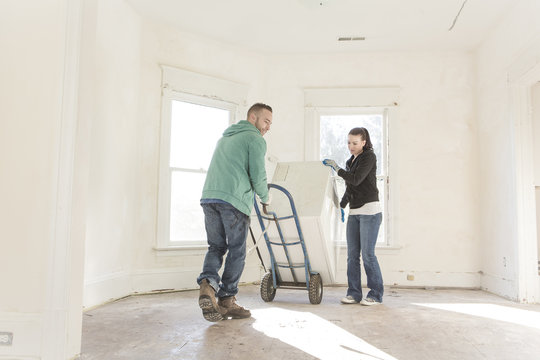 Mixed race couple moving into new home