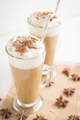 Coffee in glass on the wooden background