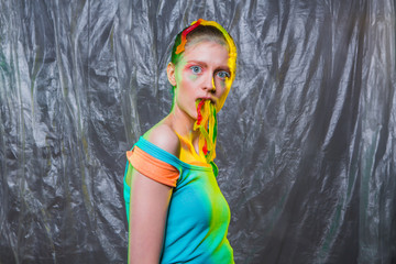 Young woman with gummy jelly worms candies