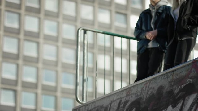 Skater jumps into halfpipe