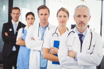 Medical team standing with arms crossed