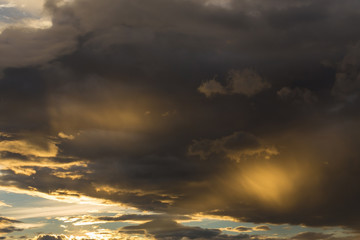 Fototapeta premium golden sunset sky and glowing cloud, twilight sky before rain