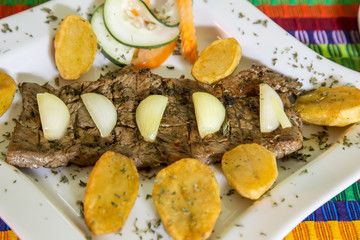 beef steak cooked with onion and platan