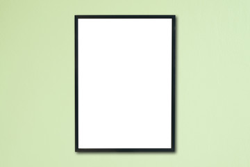Mock up blank frame hanging on wall in room