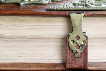 Old book in leather cover with a lock.
