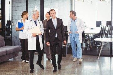 Medical team interacting each other while walking together