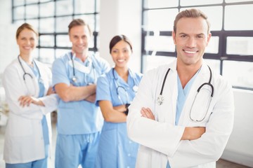 Portrait of medical team standing together with arms crossed