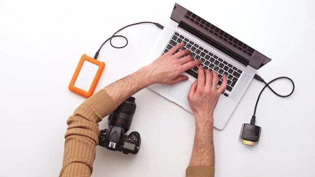 Man working at office desk. Upview
