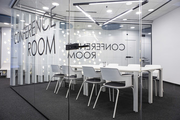 Table and chairs in empty office conference room