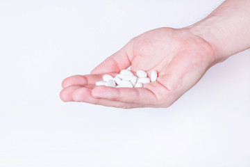 Pills on hands. Medicine background.