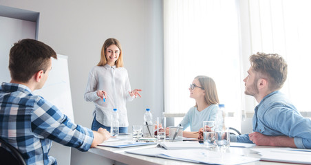 Fototapeta premium Positive colleagues discussing project