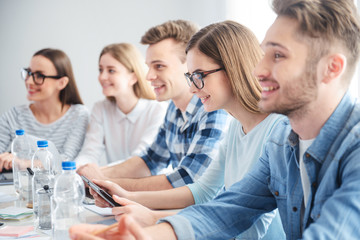 Positive colleagues sitting at the table