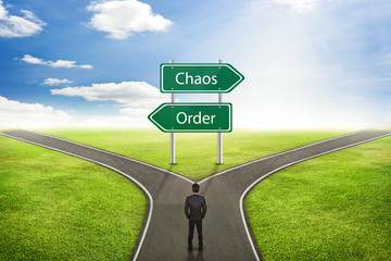 Businessman concept, Sign Chaos or Order road to the correct way