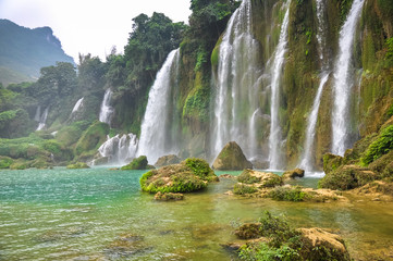 Fototapeta na wymiar Beautiful waterfall is composed of a plurality of streams
