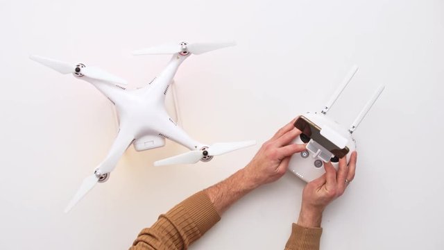 Man installing dron at his office desk. Upview