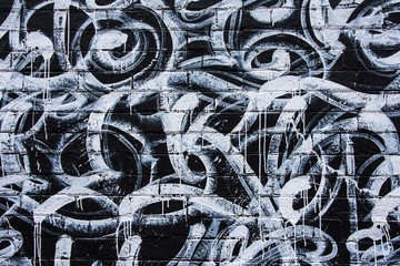 Black and White Graffiti on Brick wall 