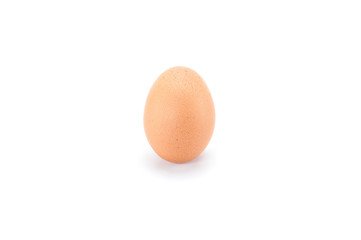 One raw fresh egg on white background.