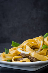 Chinese food. Beef chow mein on slate
