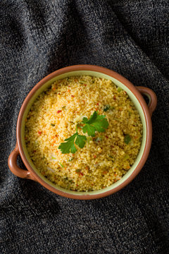 Couscous with vegetables on tablecloth
